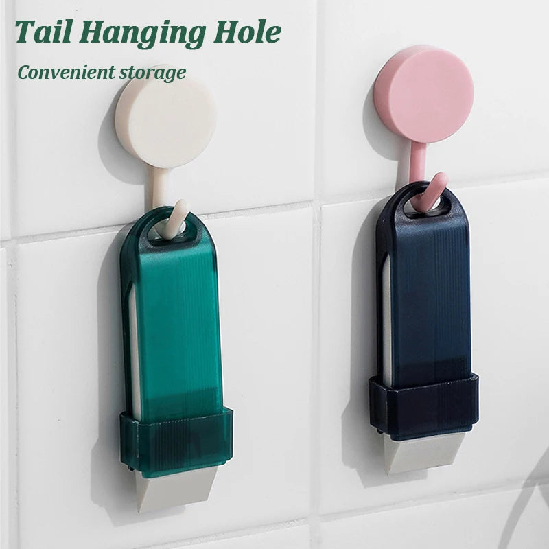 Convenient storage solution featuring green and navy hanging tools with tail holes for easy access on a tiled wall.